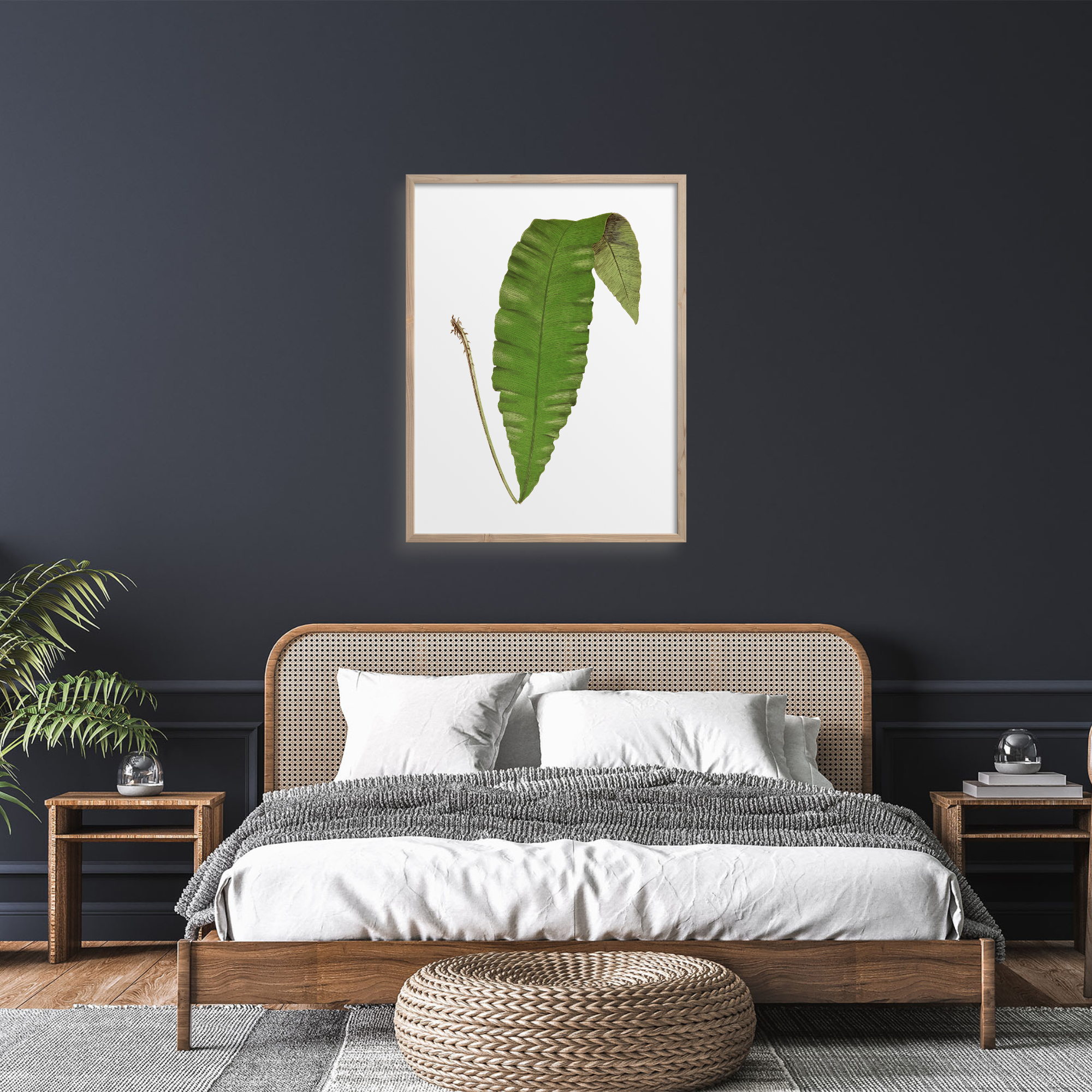 Large green fern art print on a dark wall.