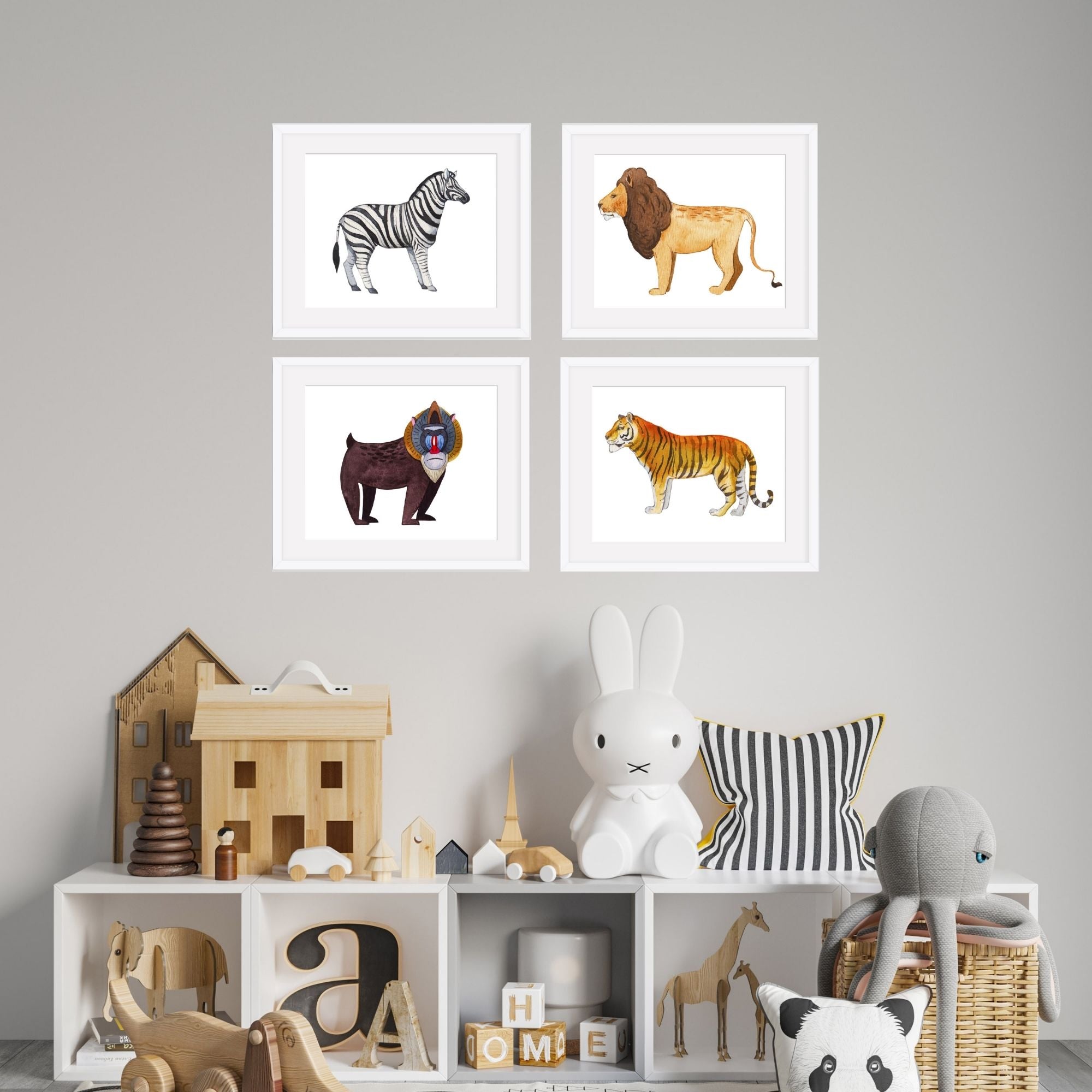 Four animal nursery prints over a child's bookshelf.