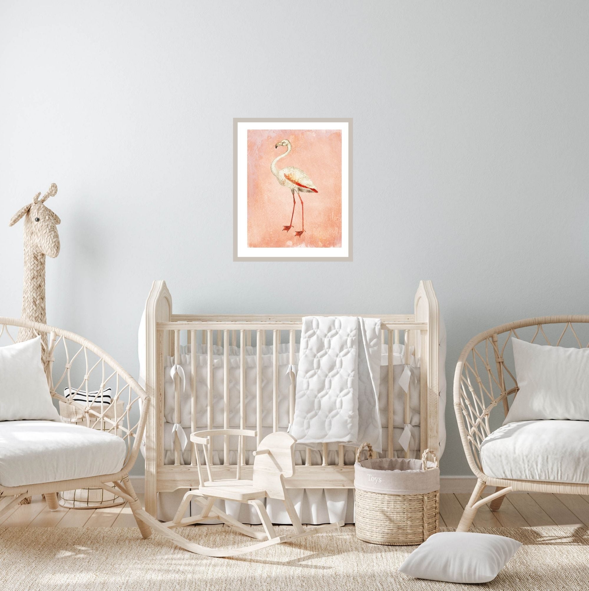 Pink flamingo art print in a baby's nursery.