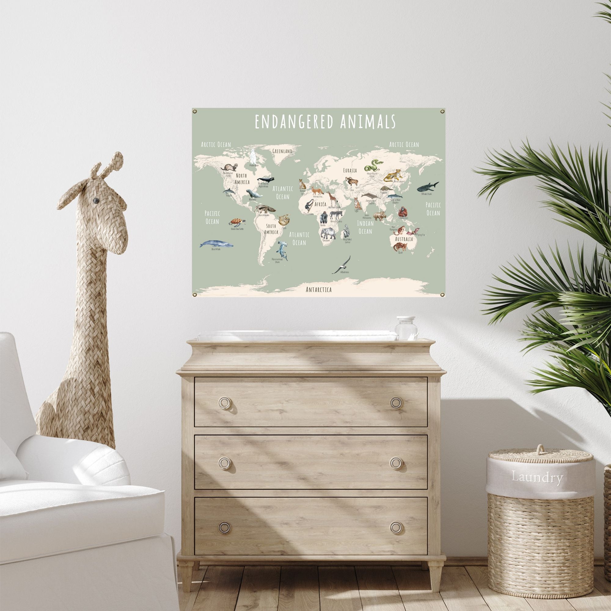 Green canvas endangered animals poster hanging over a child's dresser.