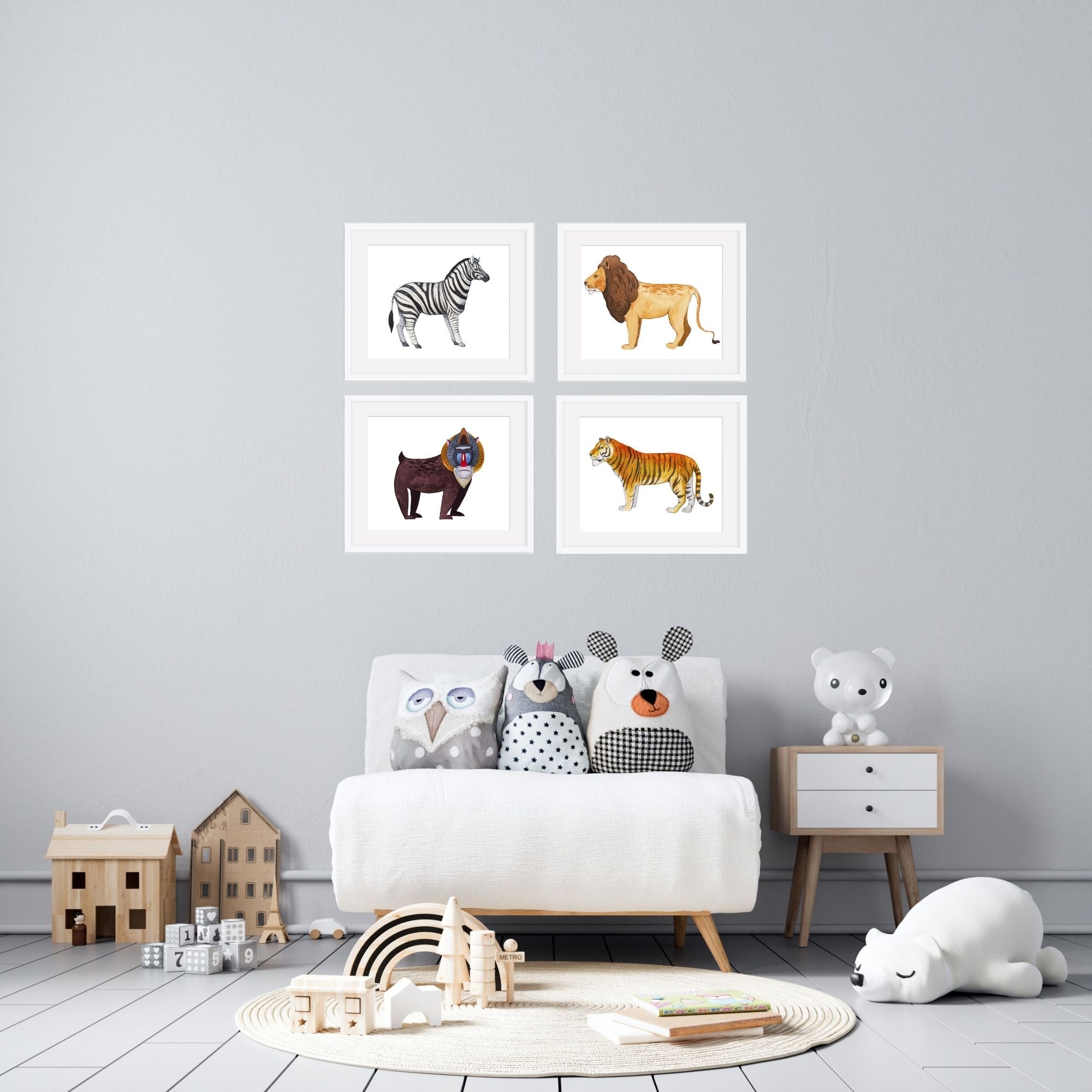 Four animal nursery prints in a child's room.