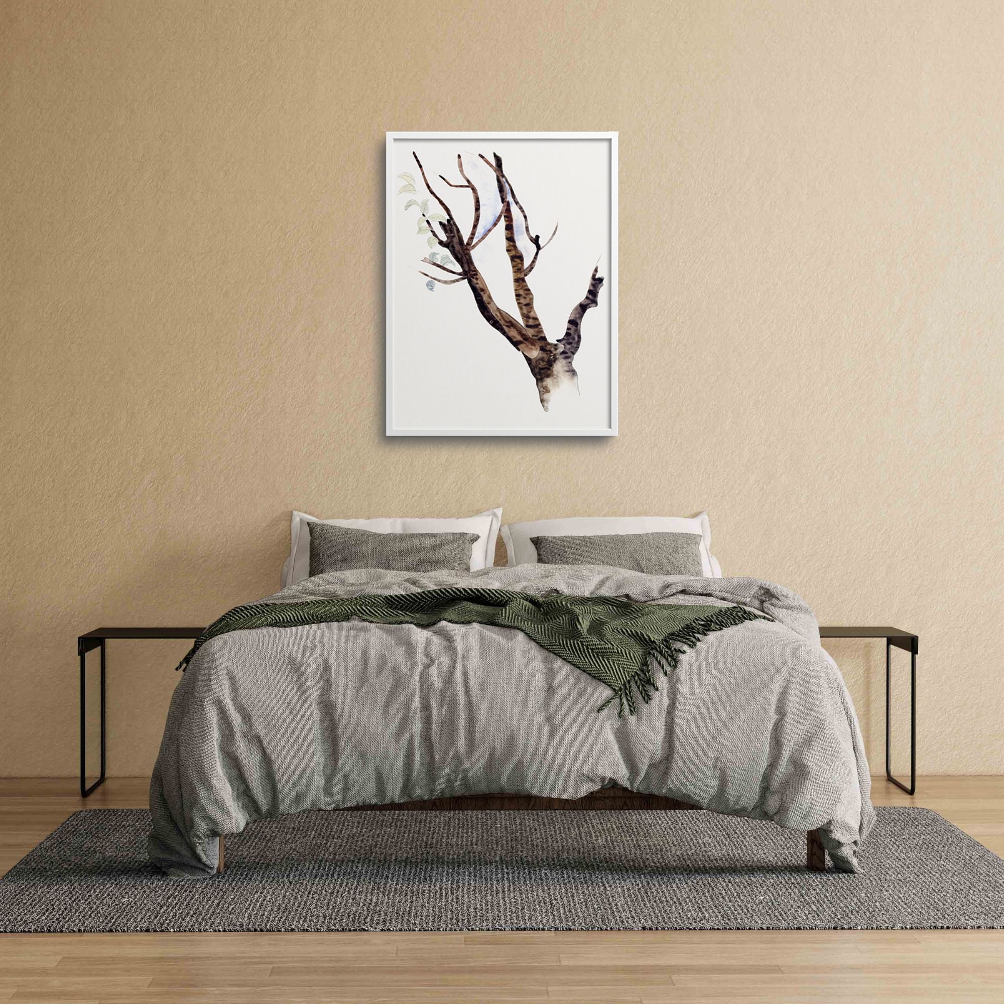 Framed tree over a bed.