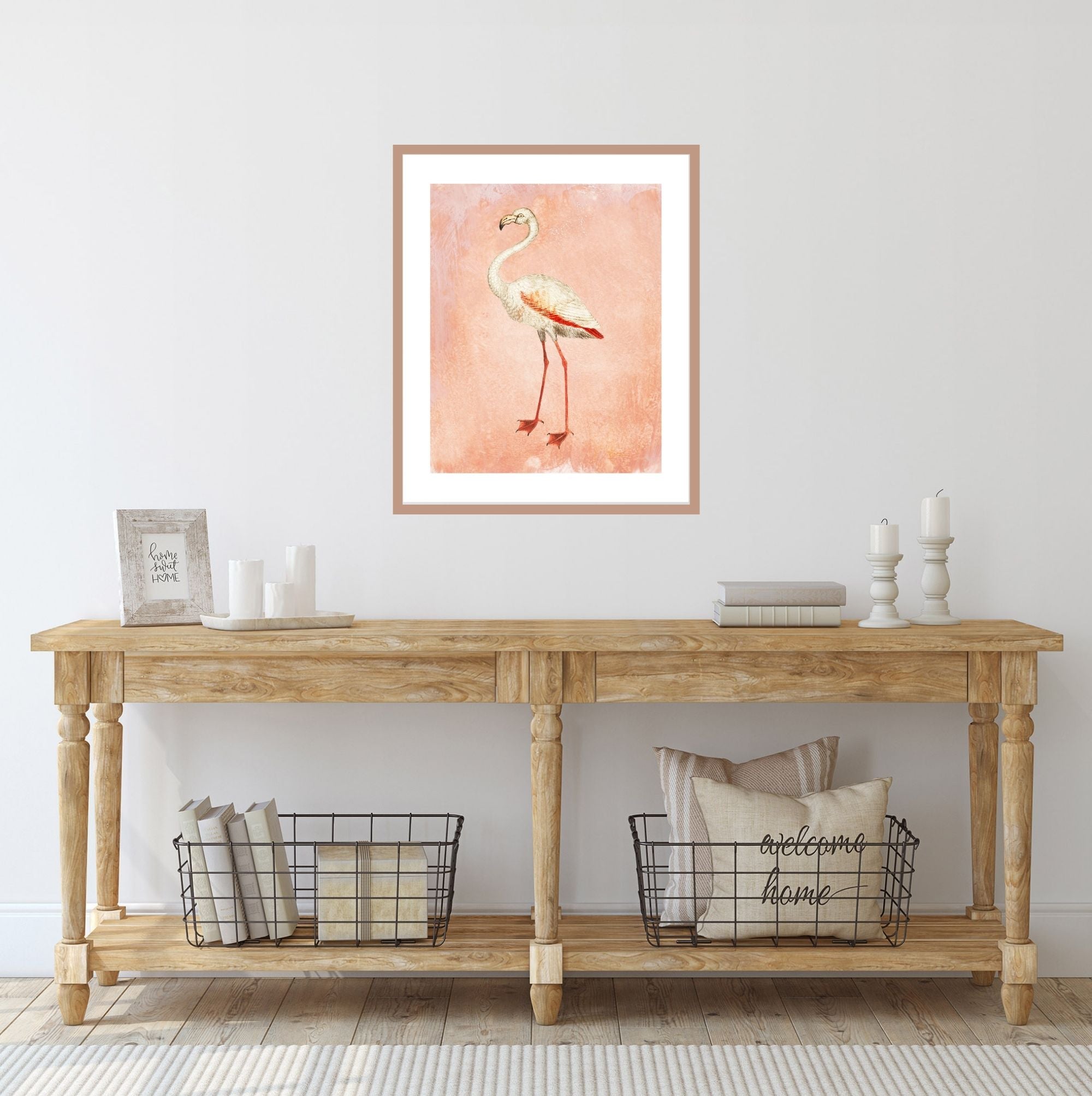 Pink flamingo art print over a farm table.