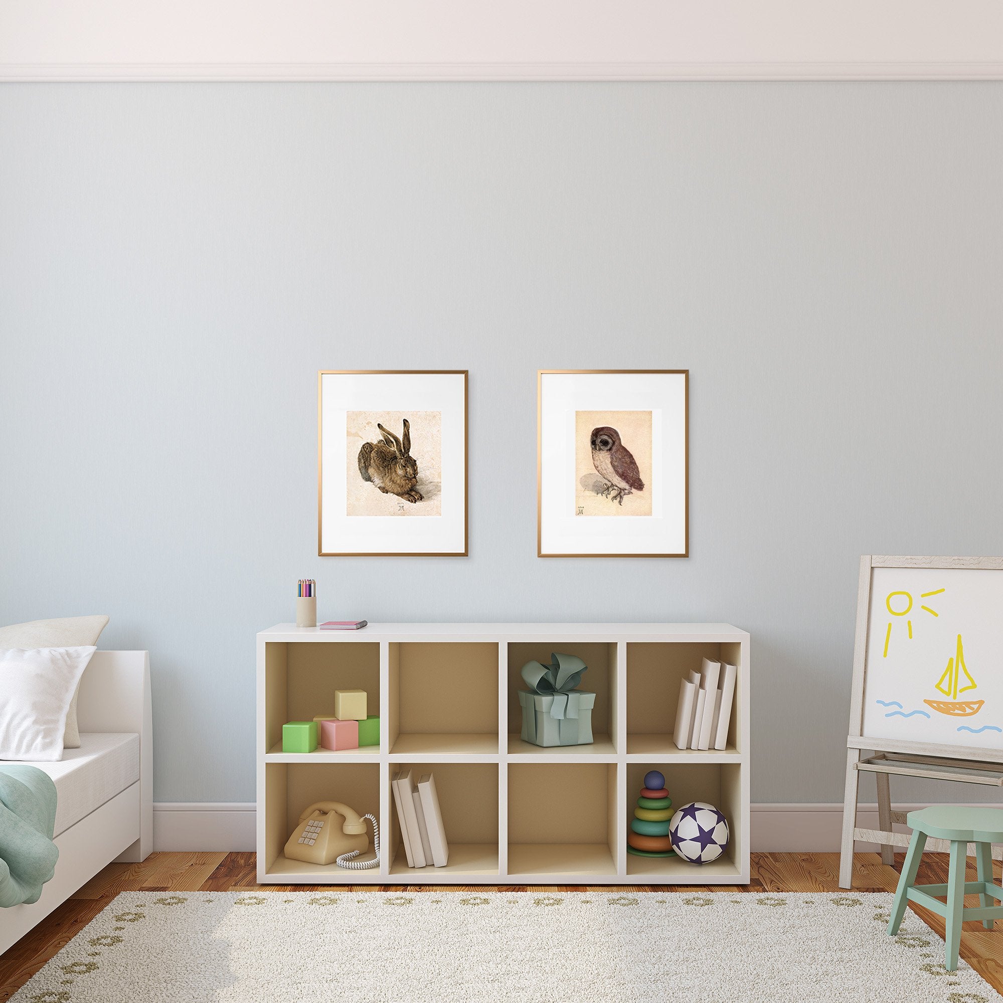 Durer's hare and owl over a bookcase in a child's room.