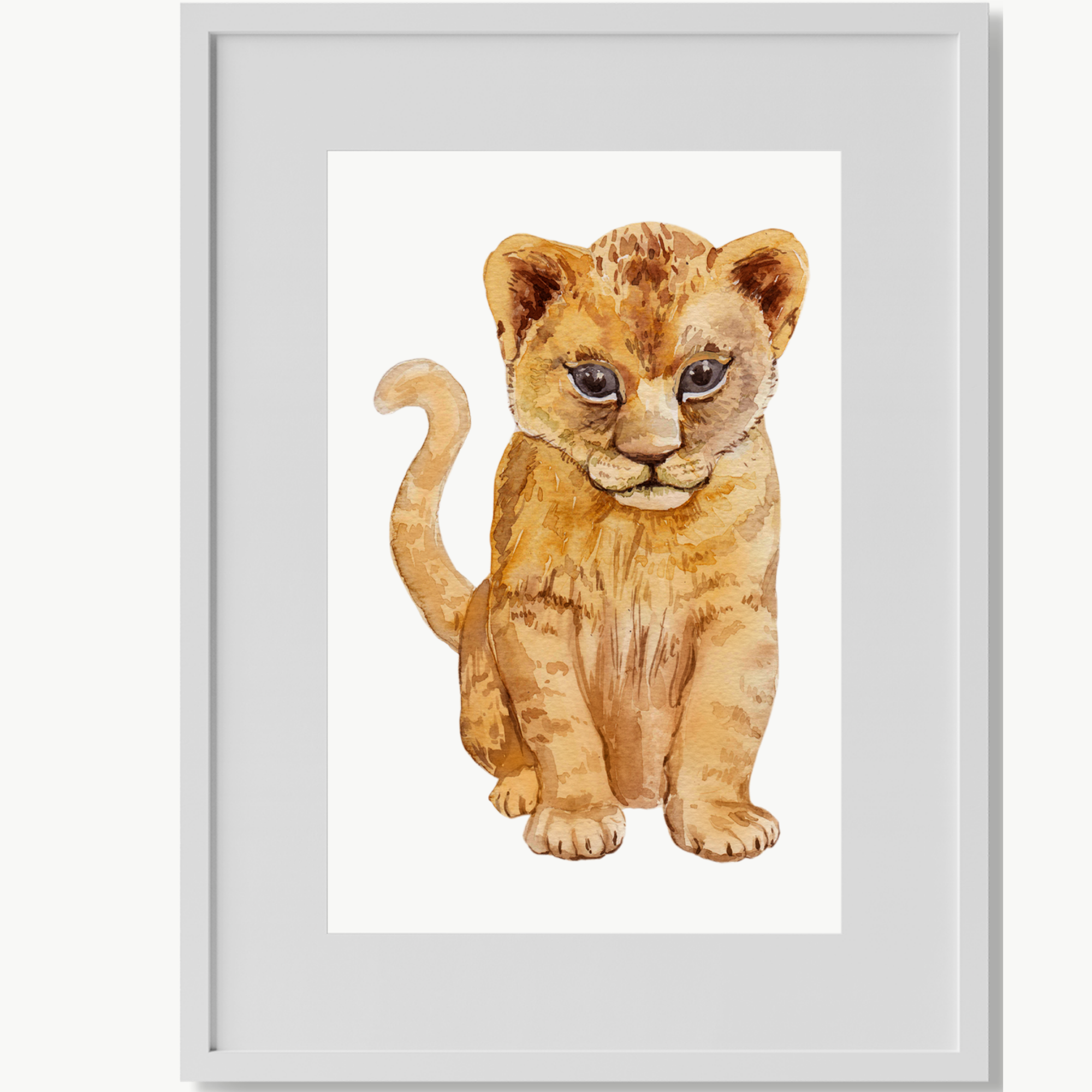 Framed lion cub art print.