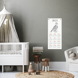 Snowy Owl 2023 calendar in a baby's nursery.