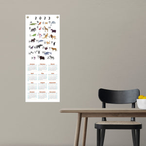 2023 alphabet calendar on a kitchen wall.