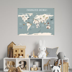 Endangered animals world map poster hanging over a child's bookcase.