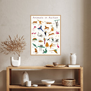 alphabet poster with cartoon animals over a bookcase