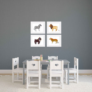 Four animal nursery prints in a playroom.