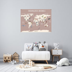 Pink endangered animals world map over a child's chair.