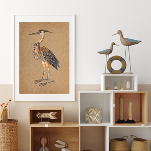 Framed heron art print next to a shelf.