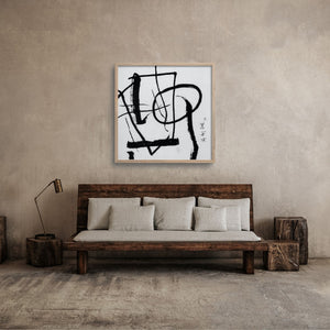 Saburo Hasegawa print over a rustic sofa in a japandi minimalist room