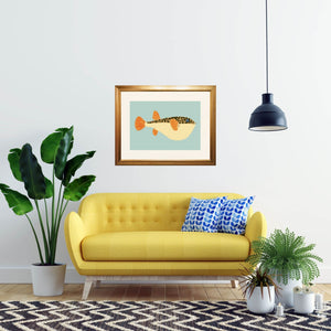 Framed puffer fish in a living room.