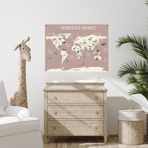 Endangered animals world map in pink, hanging over a dresser in a child's room.