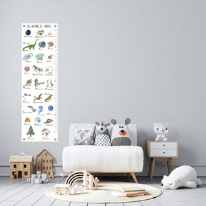 child's playroom with science alphabet measurement chart hanging on the wall
