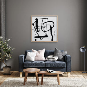 Hasegawa art print over a grey sofa in a nordic style room with mid-century modern coffee tables.
