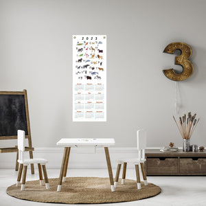 2023 animal alphabet calendar in a child's playroom.