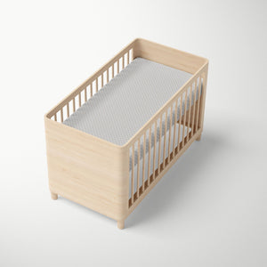Grey Shibori organic fitted crib sheet.