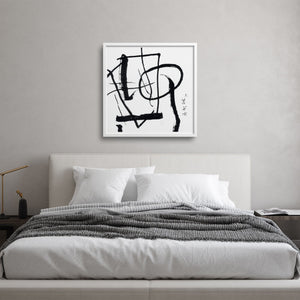Abstract calligraphy over a japanese style bed in a minimalist bedroom 