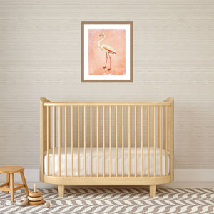 Pink flamingo art print over a baby's crib.