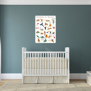 action animals poster over a crib in a baby's nursery