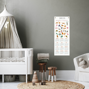 2023 action alphabet calendar in a baby's nursery.