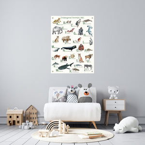 Endangered animals poster in canvas hanging over a child's chair.