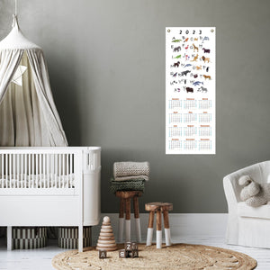 Animal alphabet calendar in a baby's nursery.