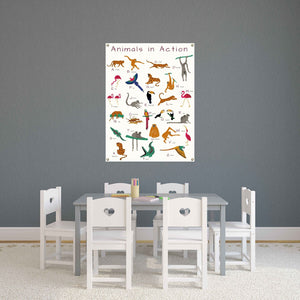 alphabet poster with cartoon animals in a classroom