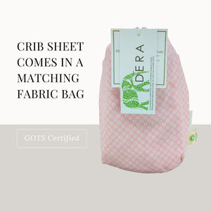 Pink shibori fabric bag for crib sheet.