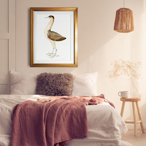 Gold framed Rudbeck Bittern bird print in a bedroom.